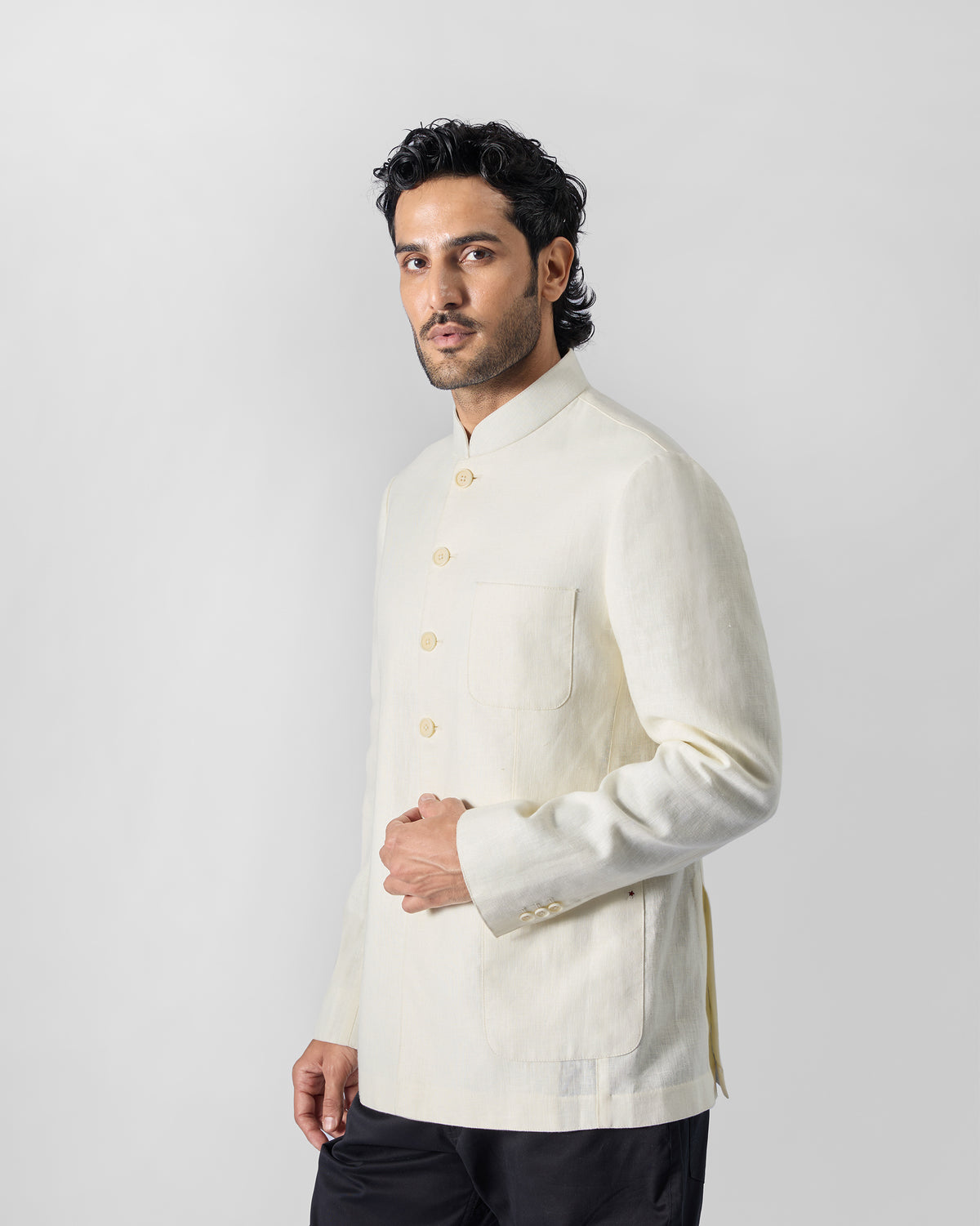 Side view of an ivory Tahr Bandhgala jacket worn by a person.