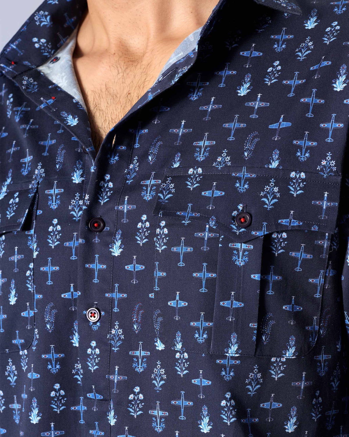 Close-up of a dark blue Hawai Sa Kurta showing small aeroplane and flower motifs.