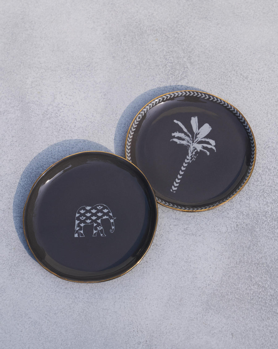The two charcoal plates, one overlapping the other.