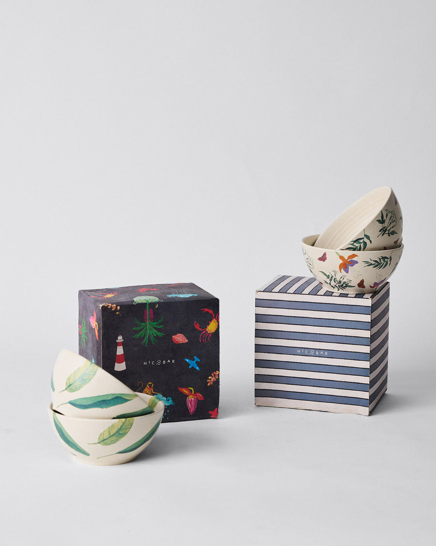 The bowls beside their Nicobar boxes.