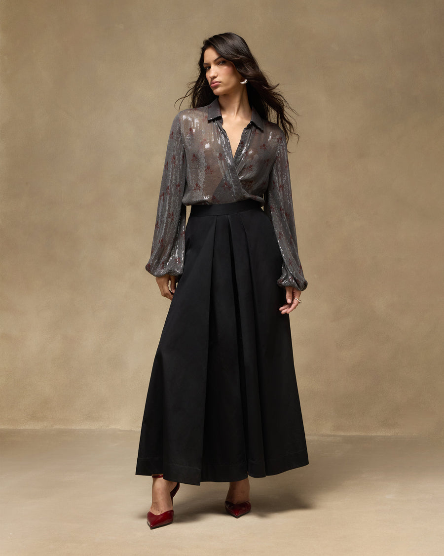 The Bacchus Shirt tucked into black, worn with a red heel.