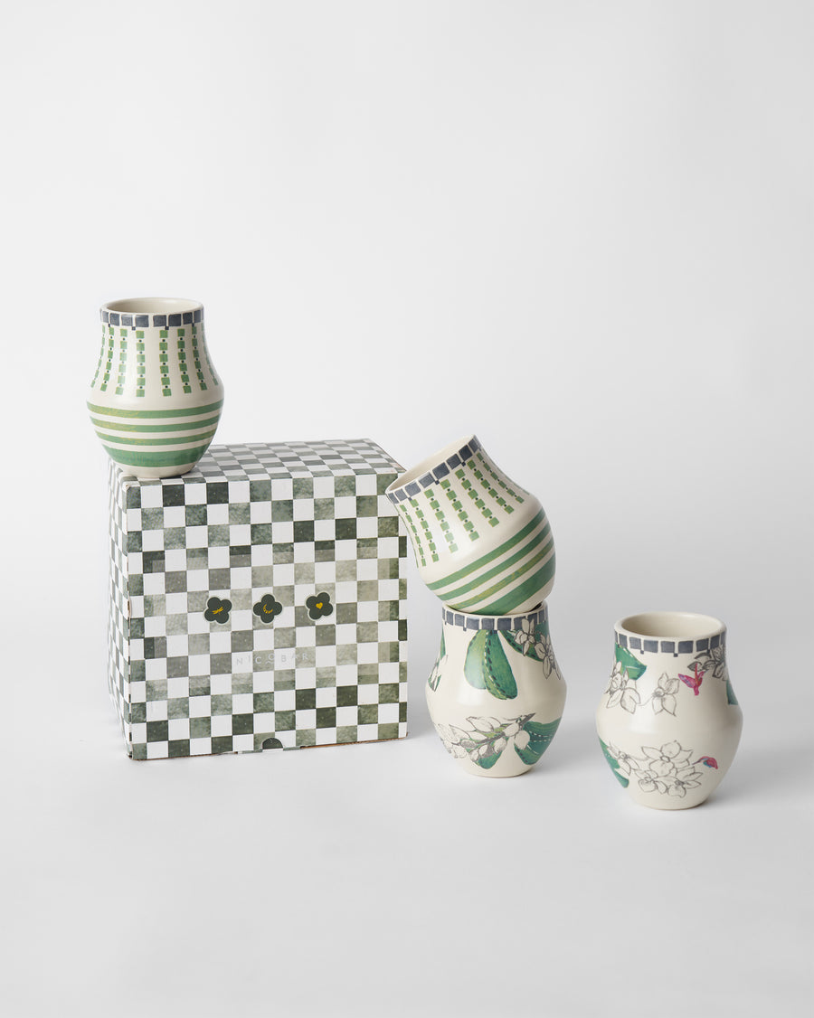 Kulhars on and beside a green checked gift box