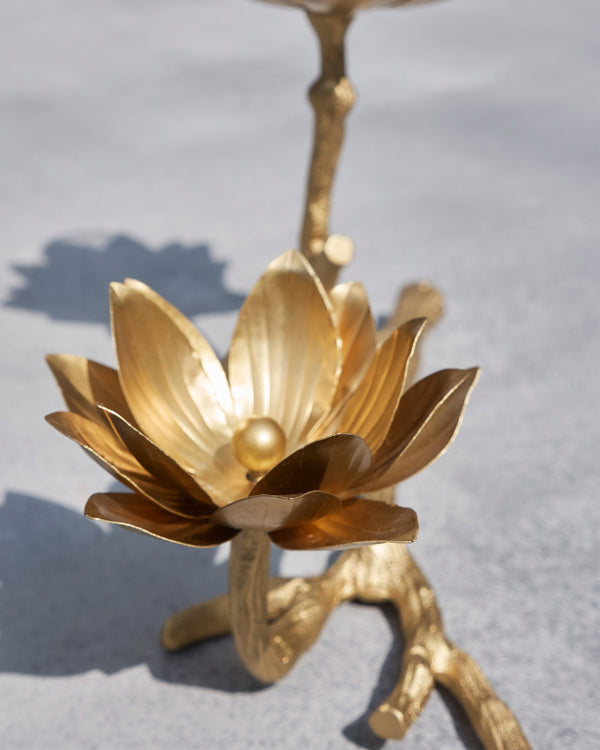 Close view of a gold lotus on the branch