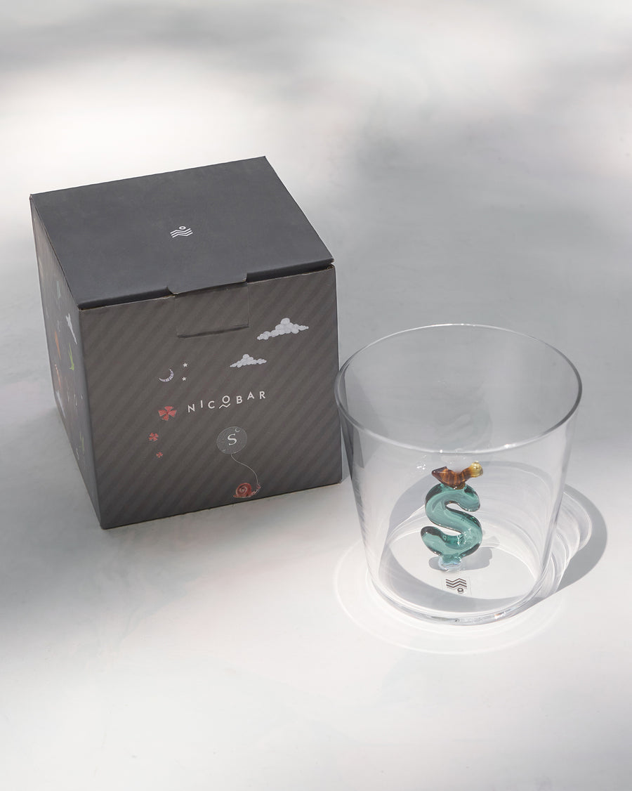 The S glass beside its charcoal Nicobar gift box