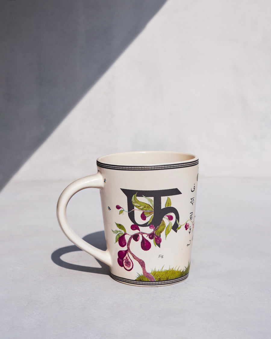The Firefly Mug side-on, with the letter फ.