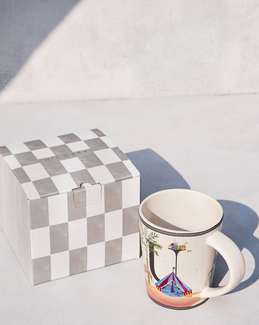 The Umbrella Mug beside its chequered Nicobar gift box.