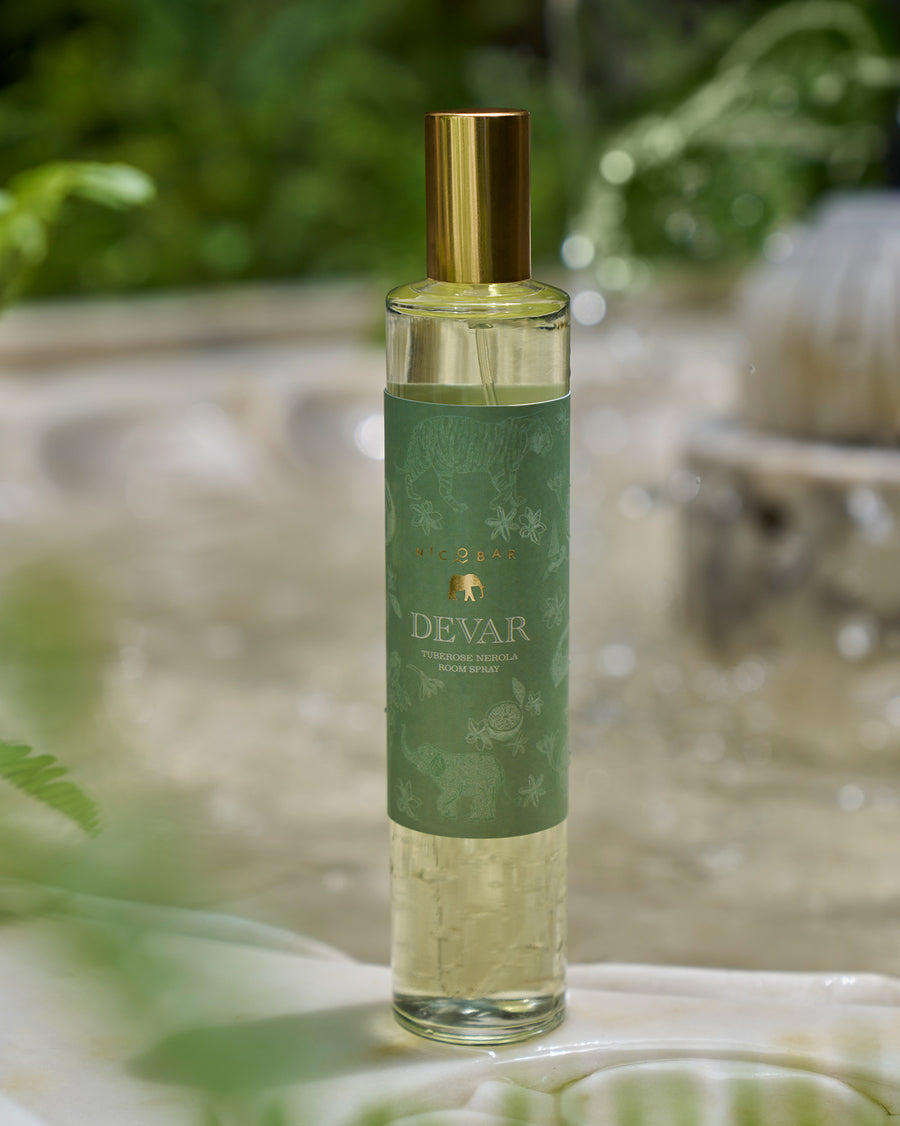 The Devar Room Spray with its gold cap and green label.