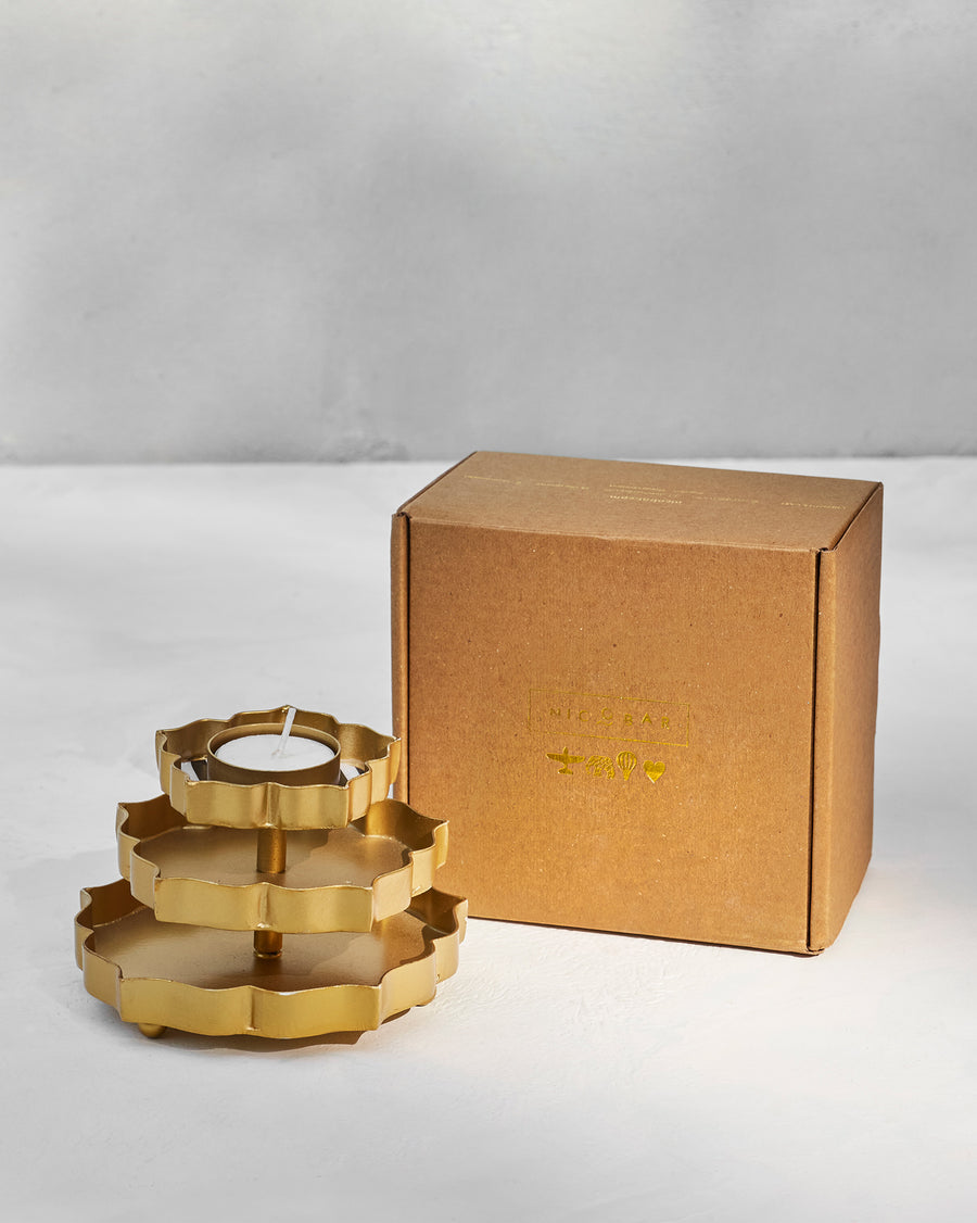 The votive beside its kraft Nicobar gift box