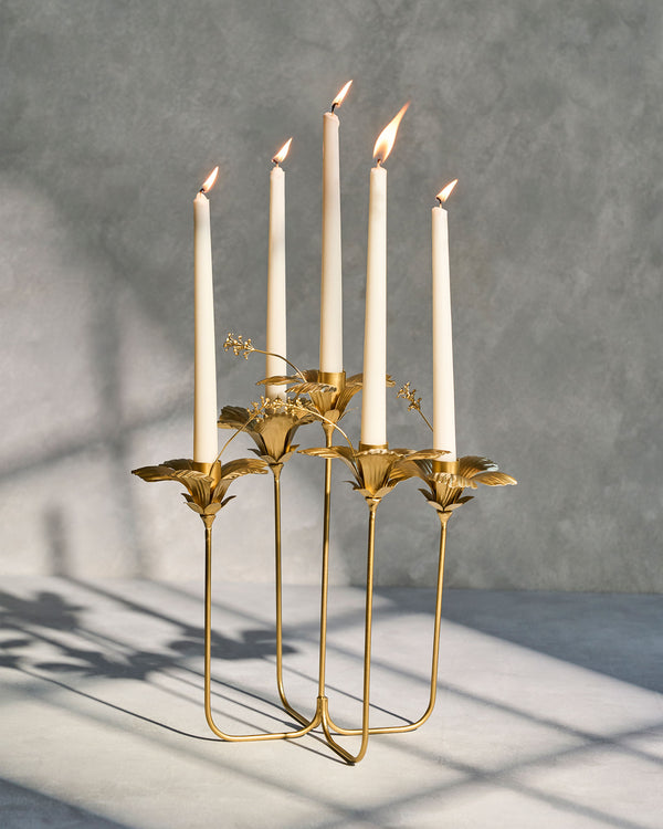 The holder with five lit candles