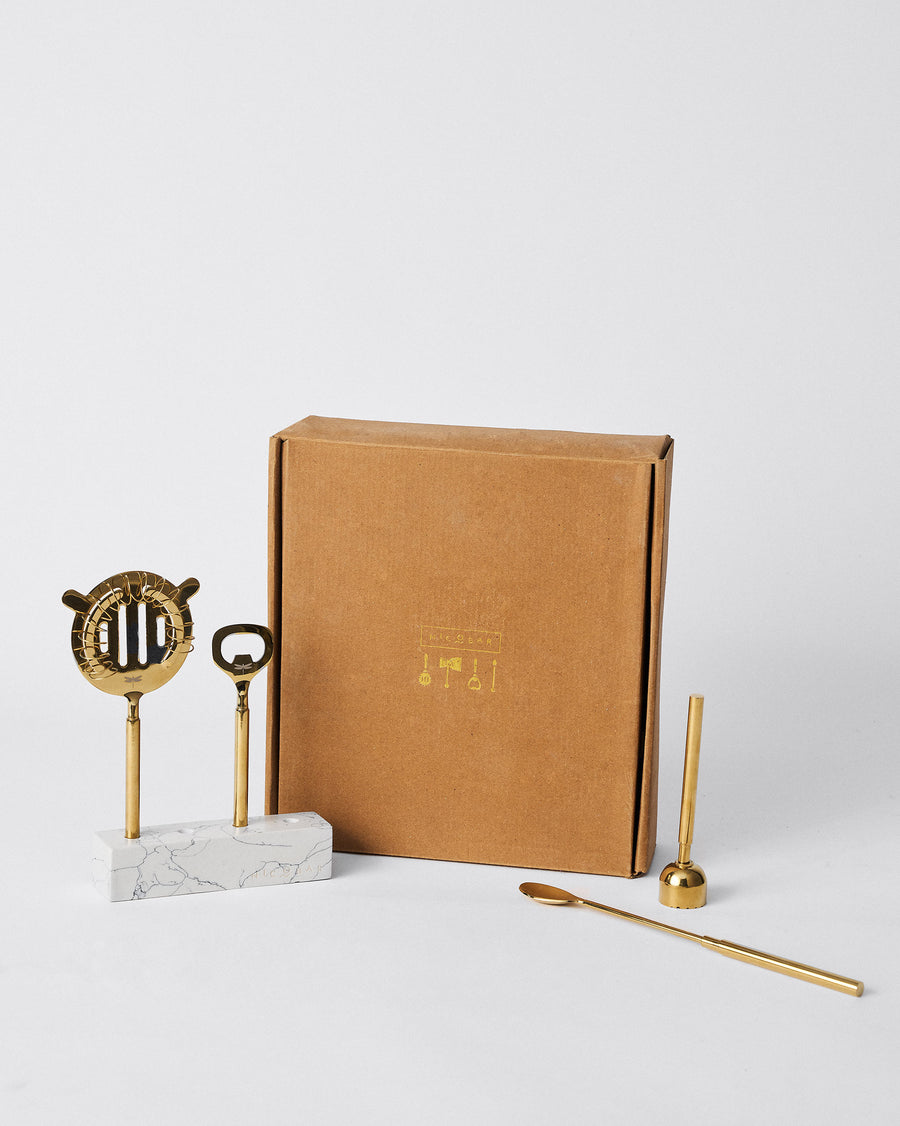 The bar tools beside their kraft gift box