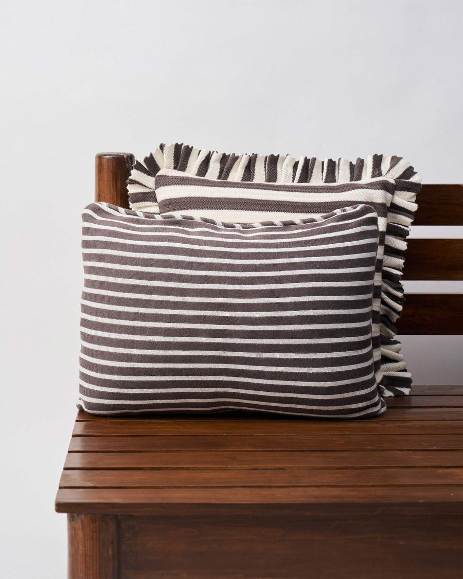 The striped back of the cushion cover.