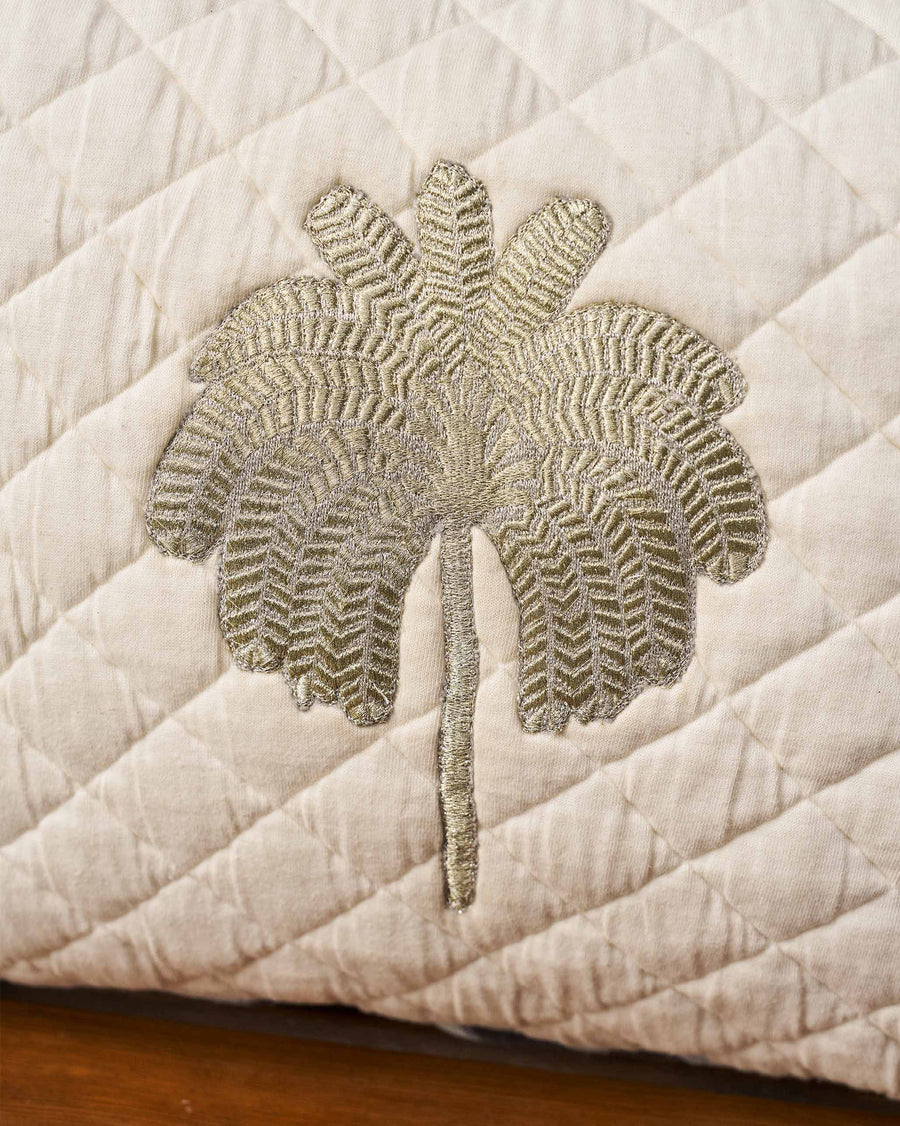 The embroidered palm close up.