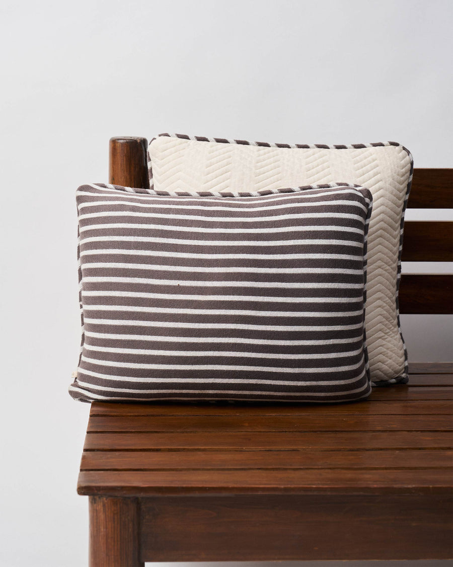 The striped back of the cushion cover.
