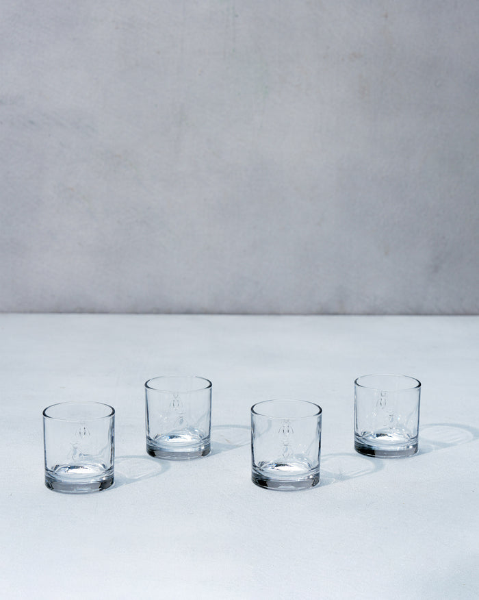 Four glasses arranged in a row