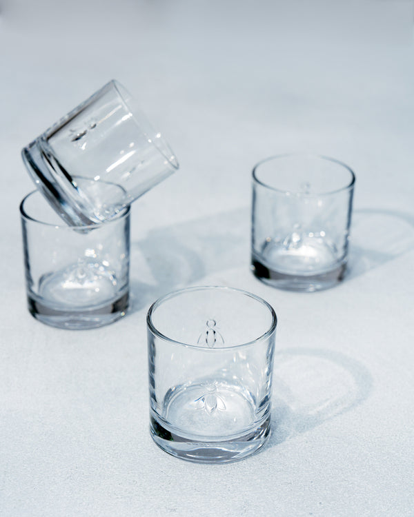 Glasses clustered, one tipped on another