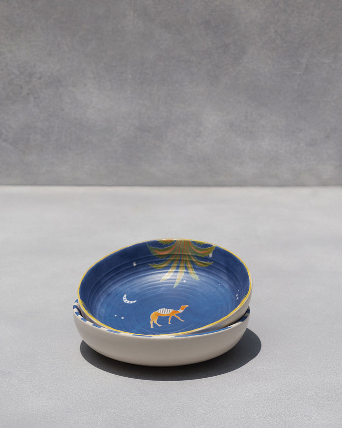 The deep blue bowl with a camel, moon and palm