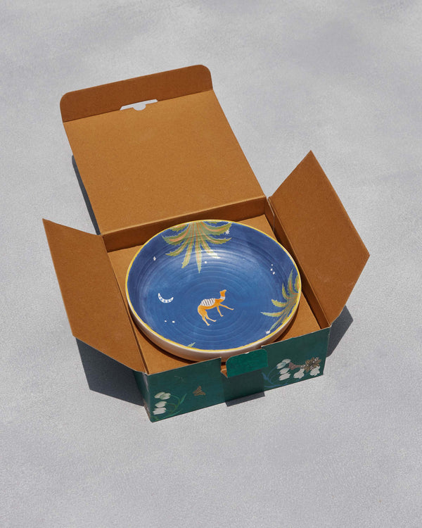 The open box with the camel bowl inside