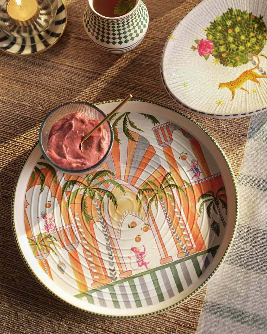 The Mirage platter with a pink dip in a glass bowl on a woven mat
