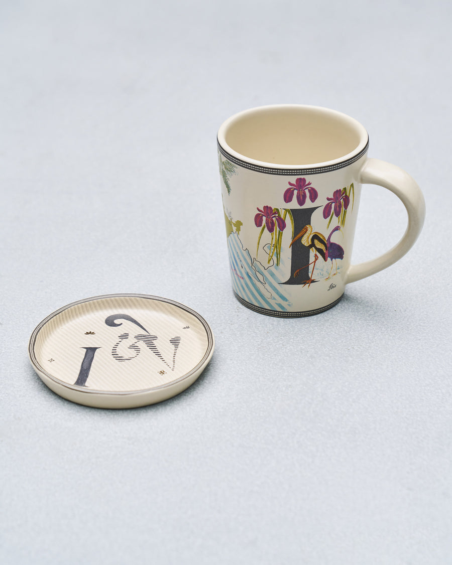 The I mug beside its coaster