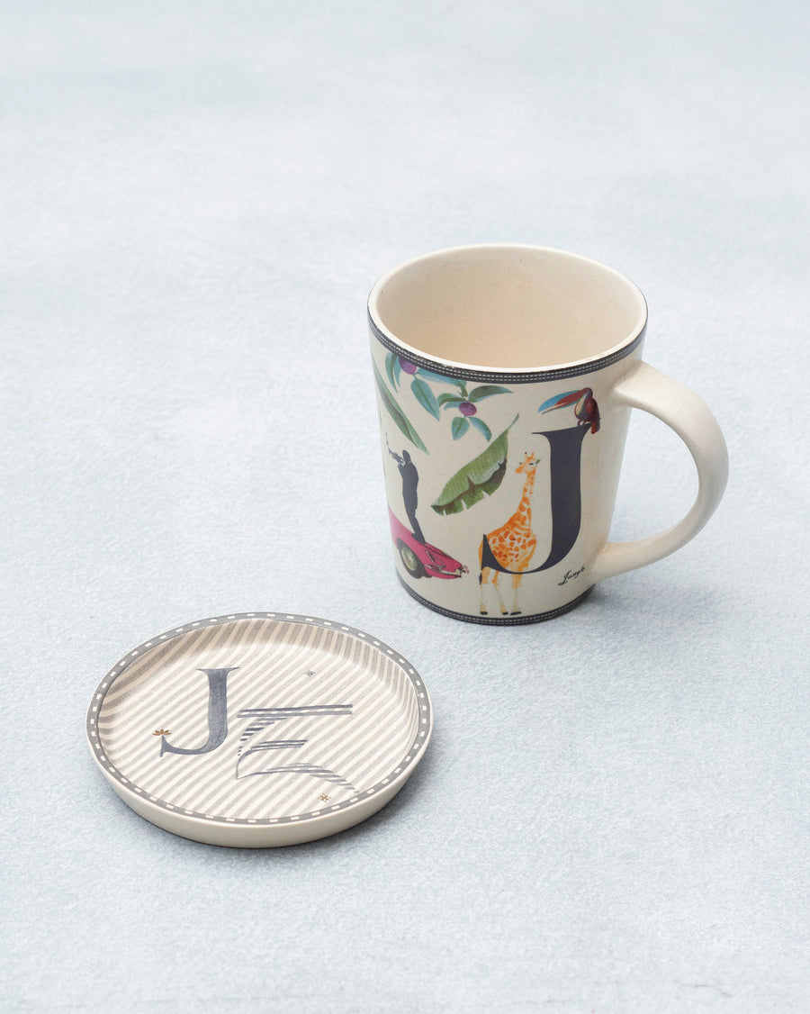 The J mug beside its coaster