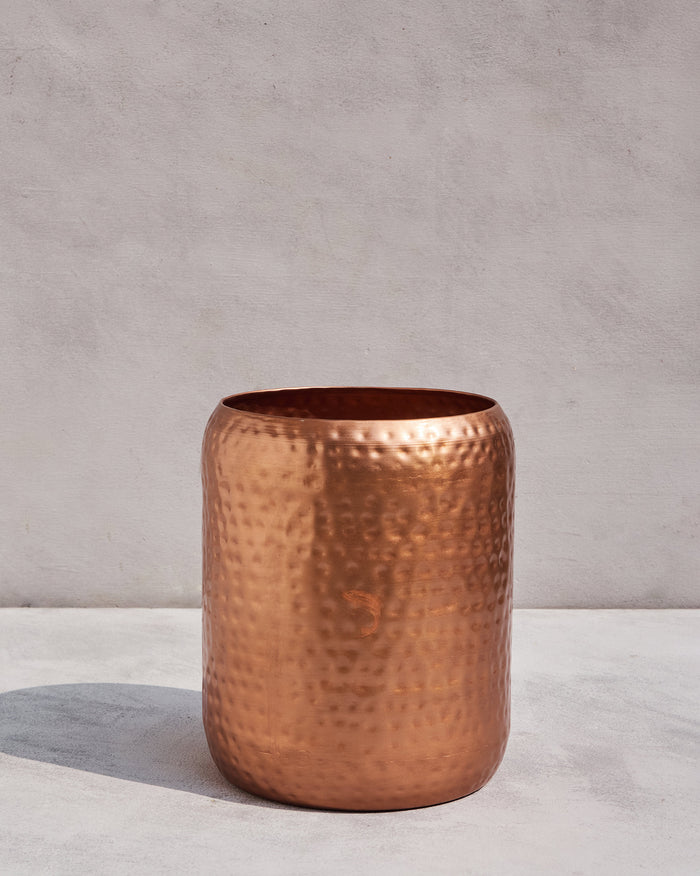 Gleam Planter Small in hammered copper with a dimpled surface.