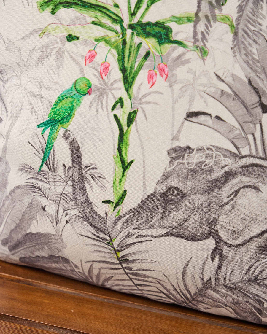 The print close up, with an elephant and a parakeet.