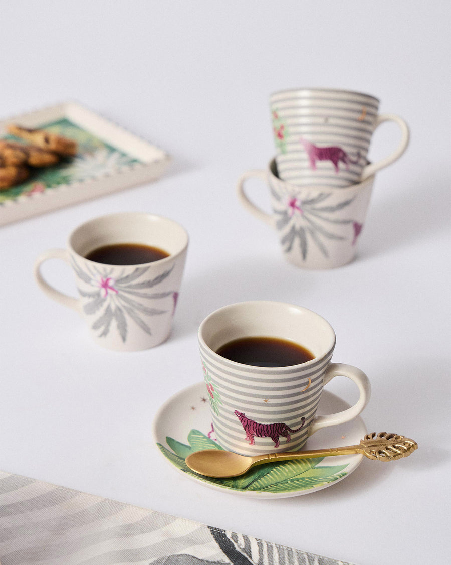Ceylon Trail mugs with coffee beside a tray of cookies