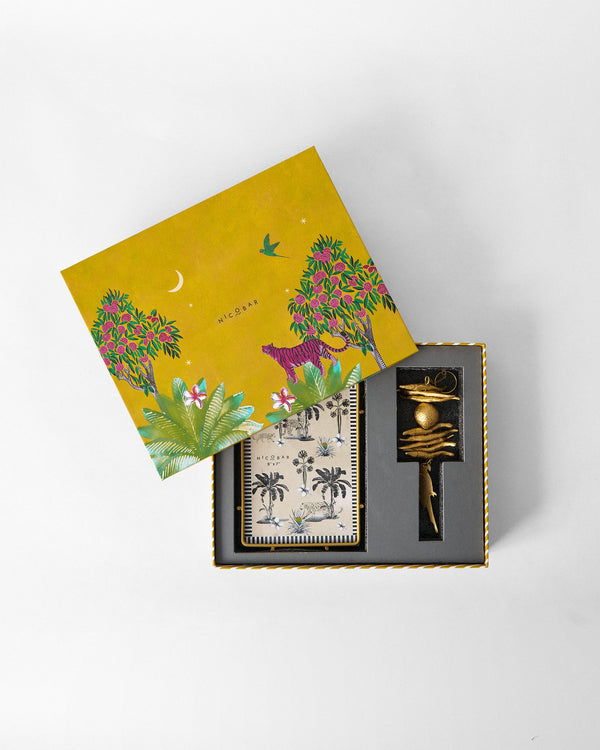 The mustard yellow box with a pink tiger and jungle trees, its lid tipped open