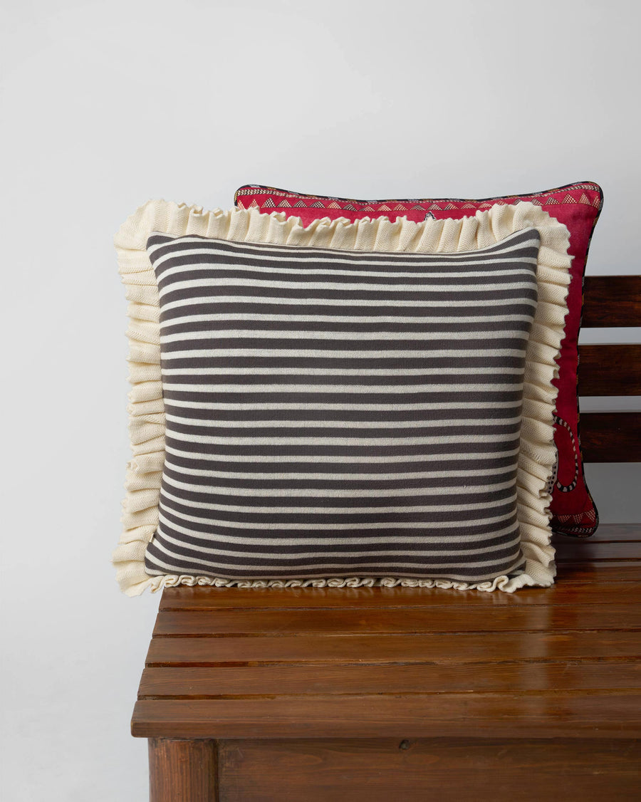 The cushion's striped reverse.