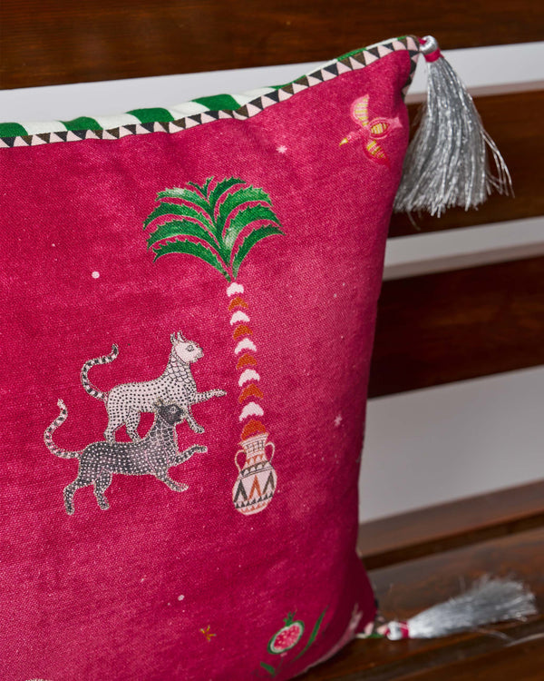 Stacked leopards beside a palm in a pot