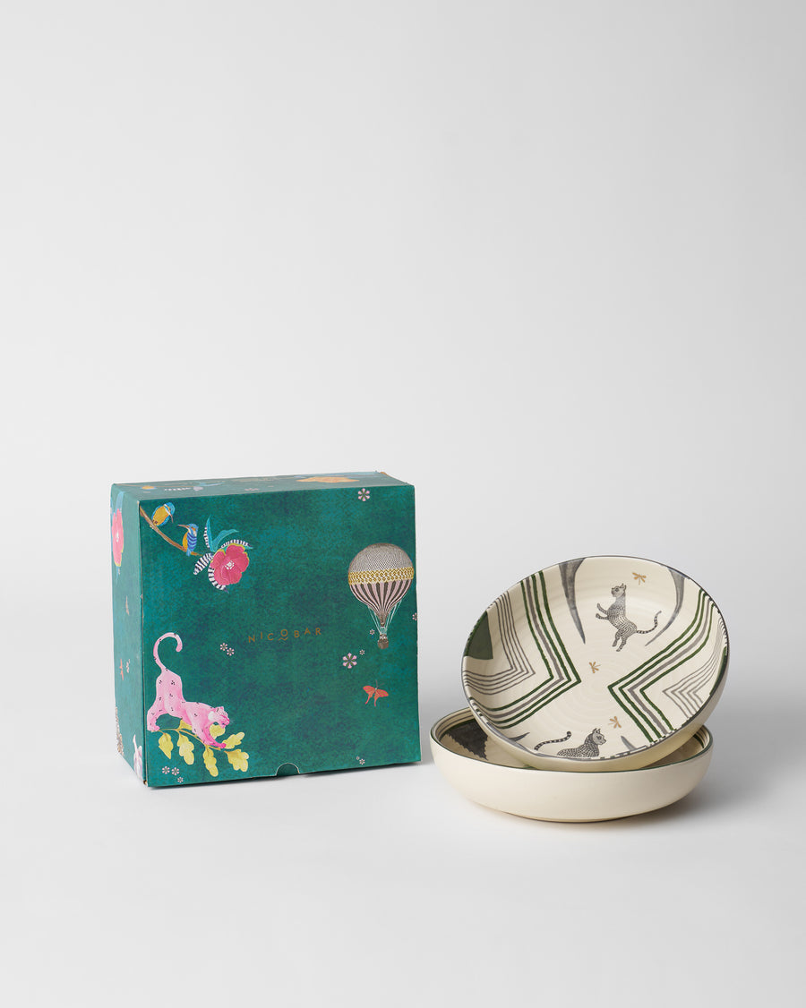 The bowls stacked beside a teal Nicobar gift box