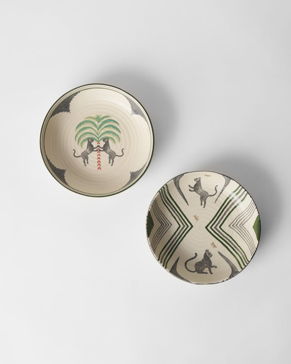 A bowl with a palm and two leopards, beside a chevron bowl