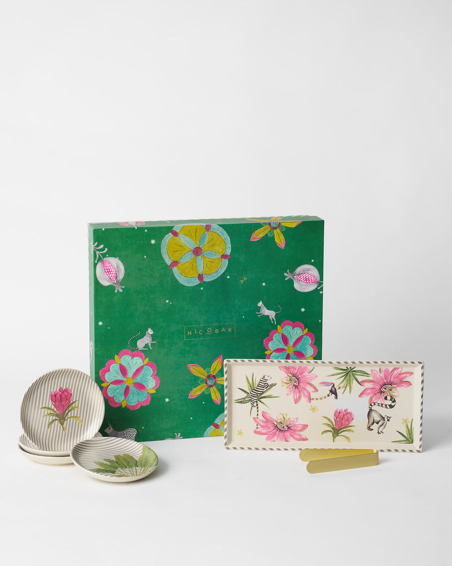 Madagascar tea plates, cookie tray and gold tongs in front of the green flowered box