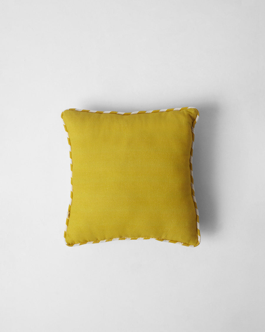 The cushion's solid yellow reverse.