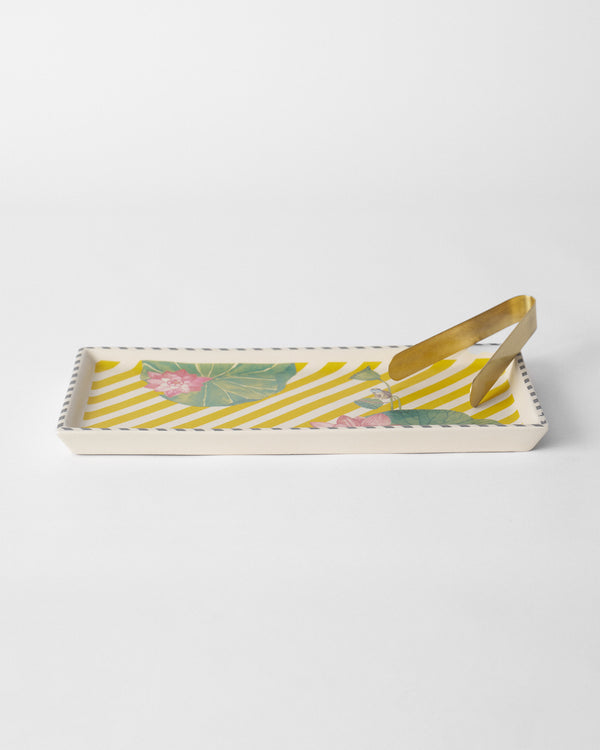 The tray side-on with tongs