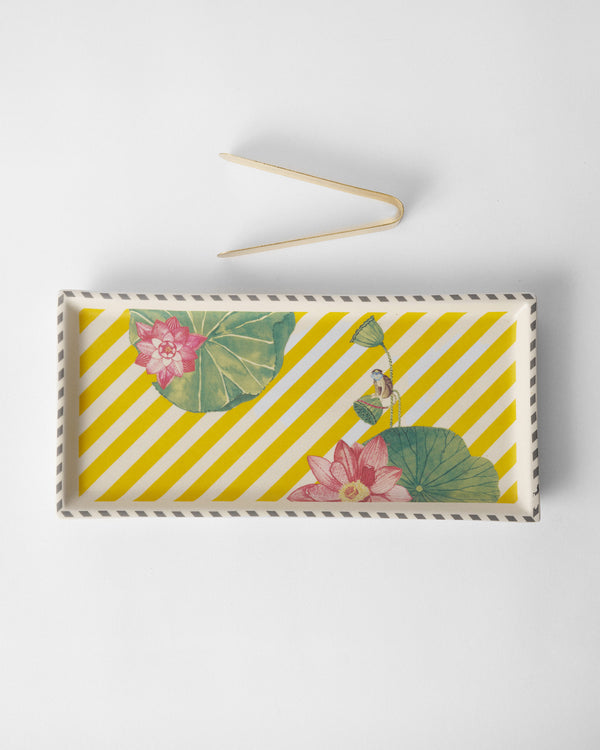 The tray with tongs laid above