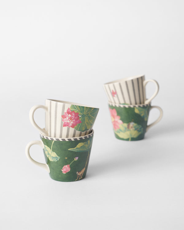 Two stacks of mugs showing lotus and monkey prints