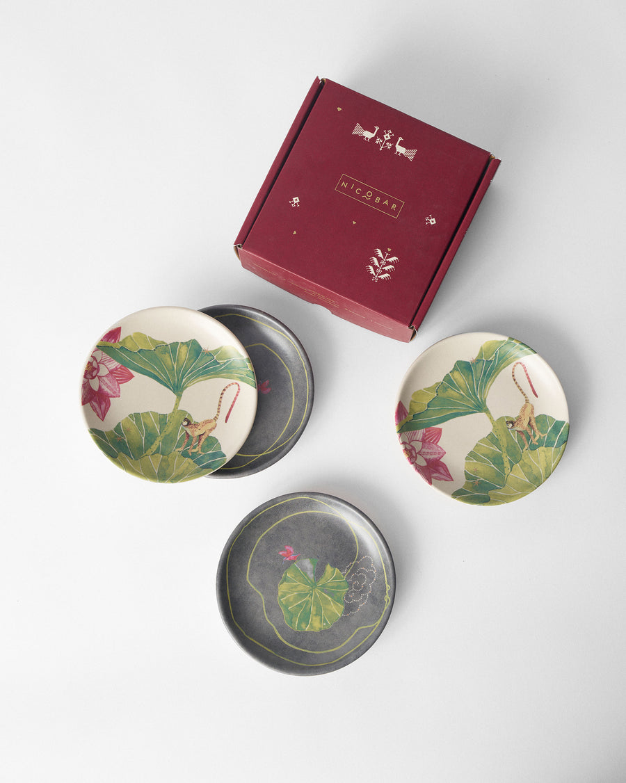 The plates beside their red gift box.