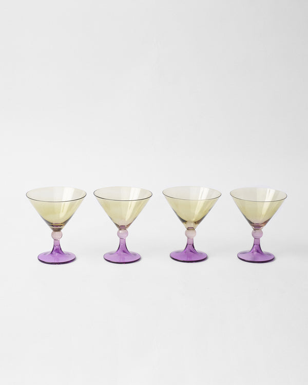 Four glasses lined up in a row