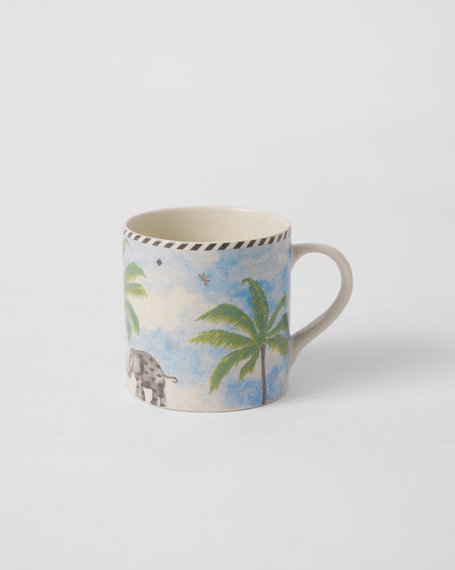 The Kandy Straight Mug with a palm and an elephant.