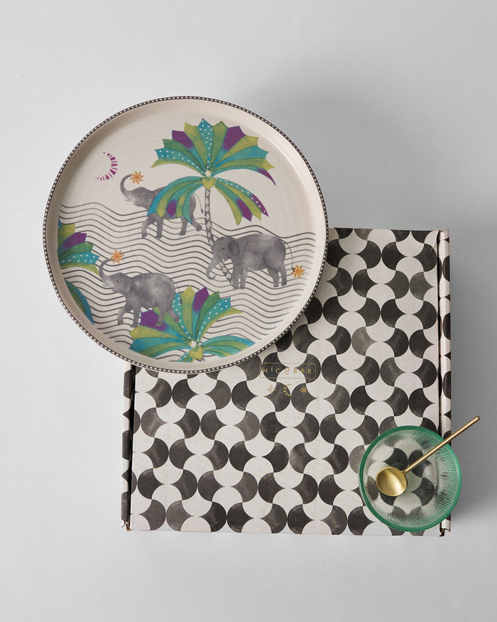 Tusk chip and dip platter resting on its patterned Nicobar gift box.
