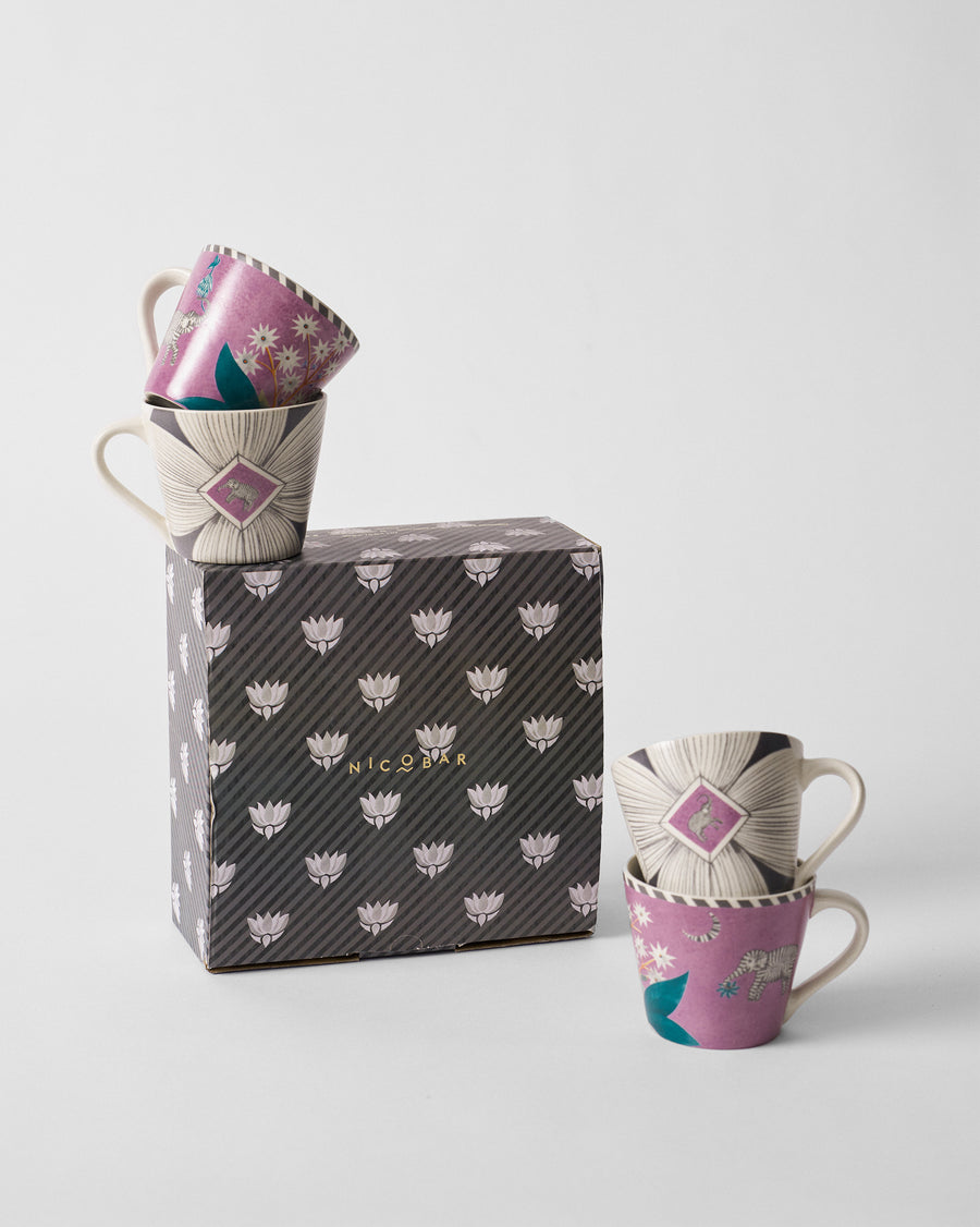 Mogra Bloom mugs stacked on and beside a black and white patterned gift box
