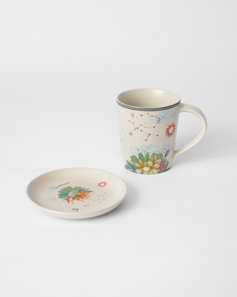 The Sagittarius mug beside its tea plate