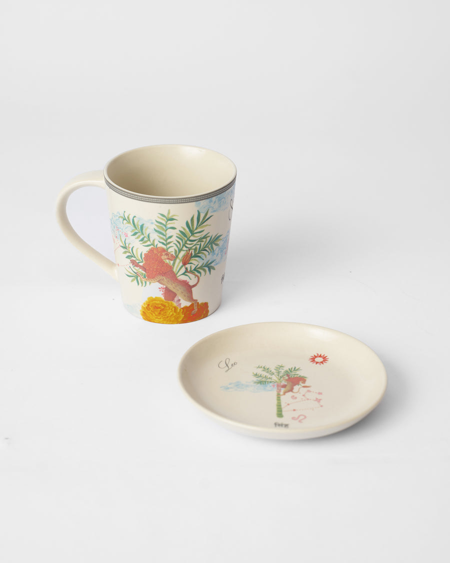 The Leo mug beside its tea plate