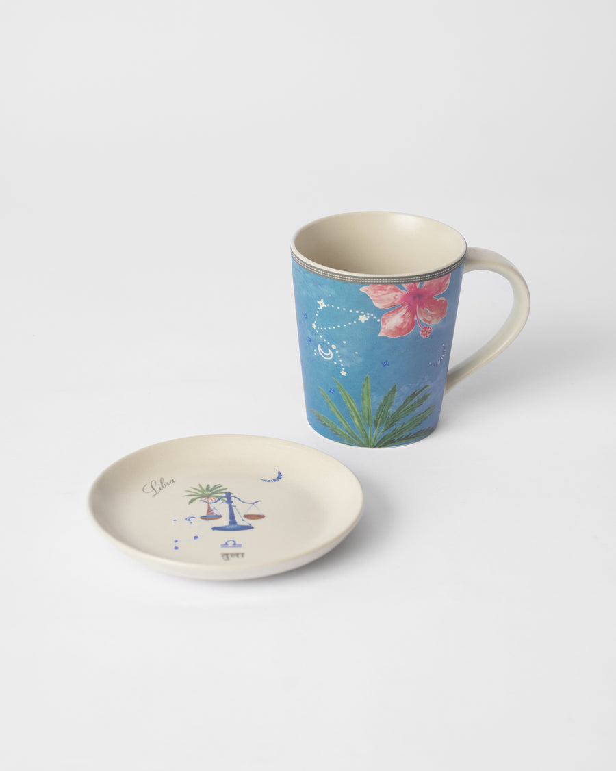 The blue Libra mug beside its tea plate