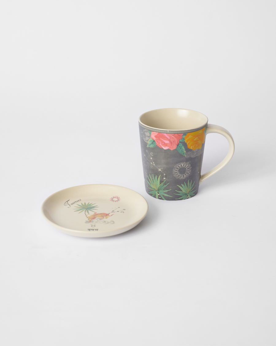 The charcoal Taurus mug beside its tea plate