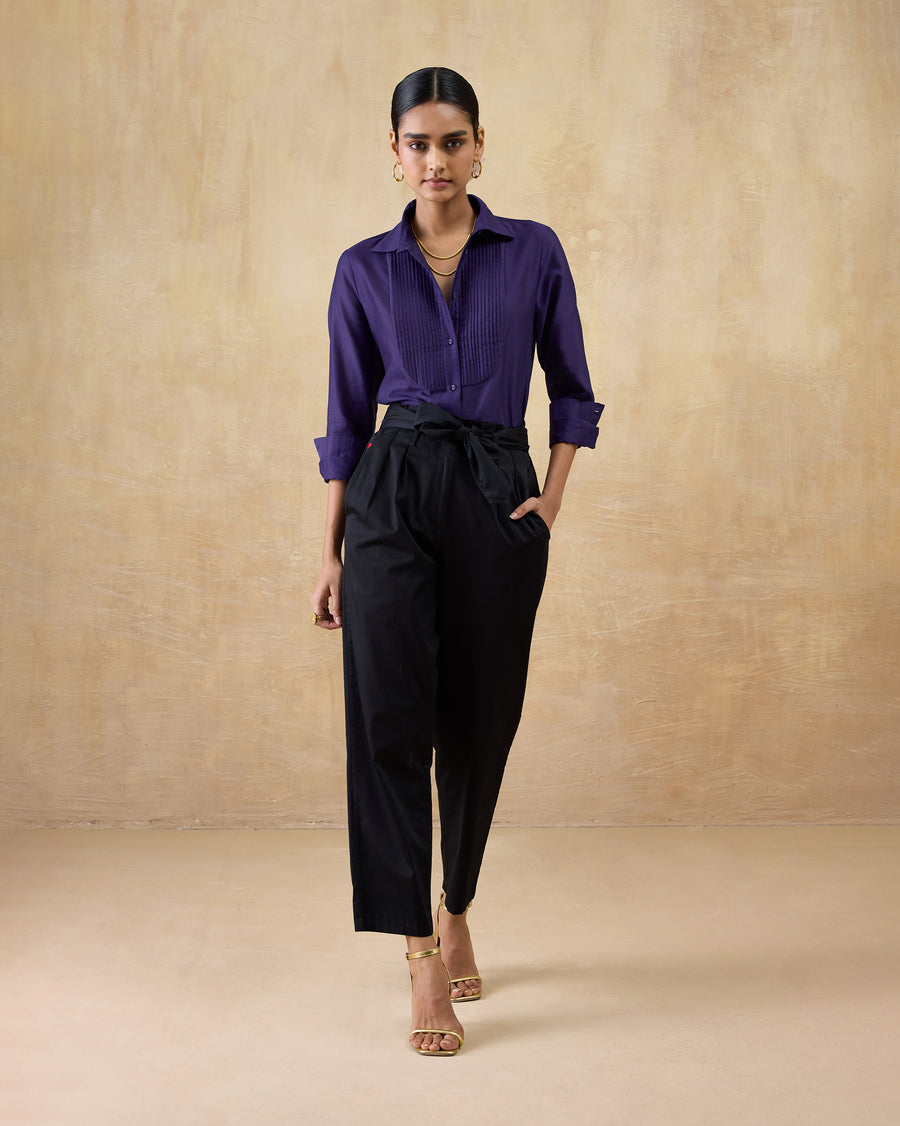 The Tuxedo Shirt tucked into black Gumdrop Pants with heels.
