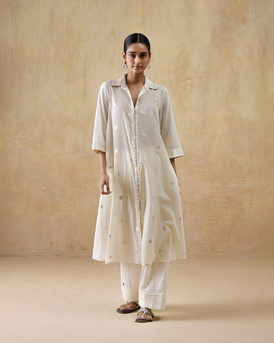 The Rejoice Kurta worn over ivory Numa Pants with flat sandals.