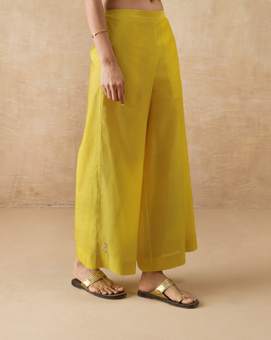 Side view of the Basic Pyjamas in chartreuse cotton silk.