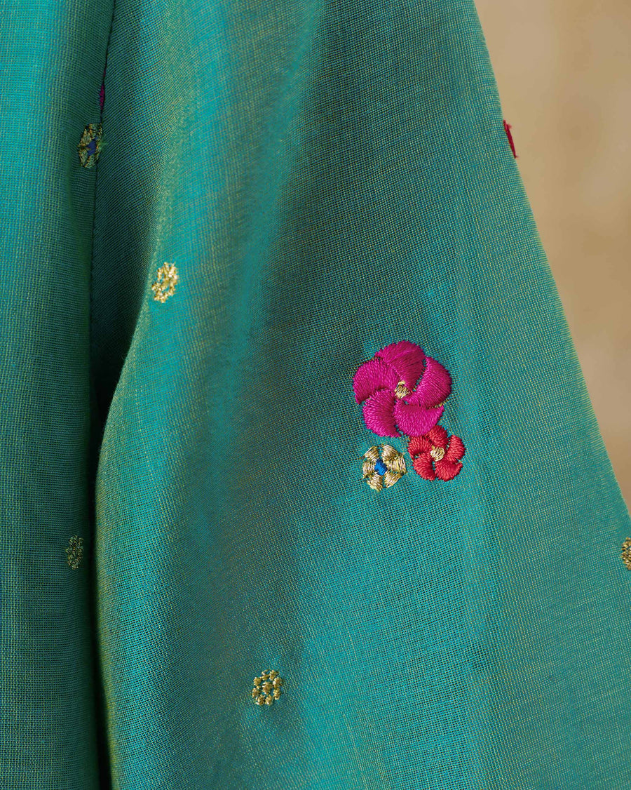 Close-up of the embroidery on the Twilight Kurta: pink and red flowers among gold florets on aqua cotton silk.